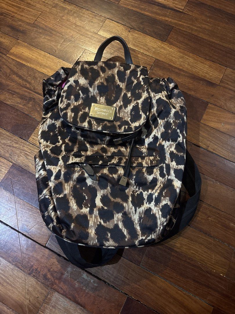 Victoria's Secret Leopard Print Mini Backpack (Category: Backpacks) located in Manila. Submitted by threadsnthings.co (Listing ID 1455639279, Image 1). Description: - Cute Victoria's Secret backpack - Fun all-over leopard print - Bright pink interior lining - Interior zippered pocket - Drawstring closure with flap top - Gold-tone hardware - Great for everyday use or a night out.