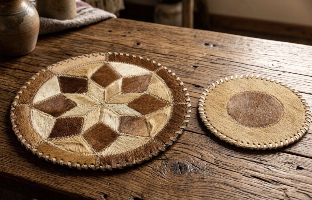 Vintage Artisan Handcrafted Patchwork Cowhide Table Mat & Trivet Set Authentic Leather Accent Duo (Category: Other Kitchenware & Tableware) located in Tagaytay City. Submitted by barenwolf (Listing ID 1455583268, Image 2). Description: A one-of-a-kind vintage treasure that seamlessly combines rustic charm with everyday utility. Crafted from genuine hair-on cowhide, this matched duo features a striking geometric starburst centerpiece mat and a coo
