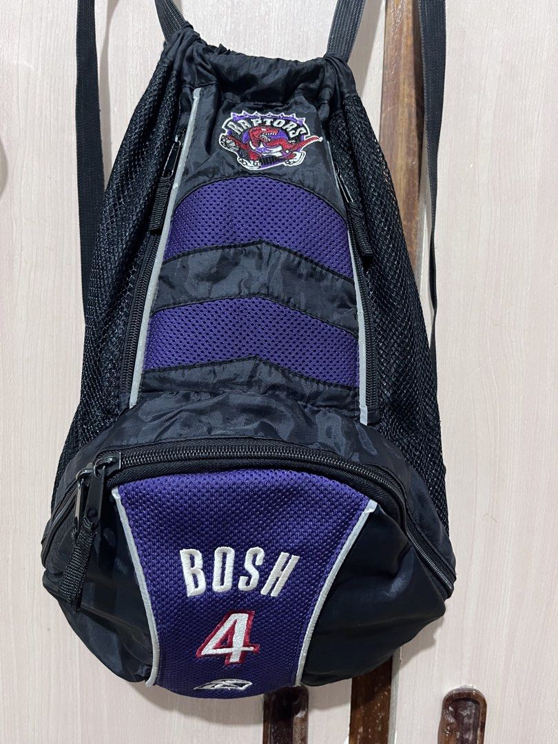 Y2k Vintage NBA Reebook Bosh backpack |free shipping (Category: Backpacks) located in Iloilo. Submitted by youronlinesister (Listing ID 1455532898, Image 1). Description: This is a vintage mid-2000s Reebok-era player-themed sling backpack from Chris Bosh’s tenure with the team (2003–2010), featuring the iconic retro purple dinosour emblem. VINTAGE NBA RAPTORS REEBOK BOSH 4 PRELOVE Maganda pa *Medyo Faded ang straps *May signs of use sa reflectori