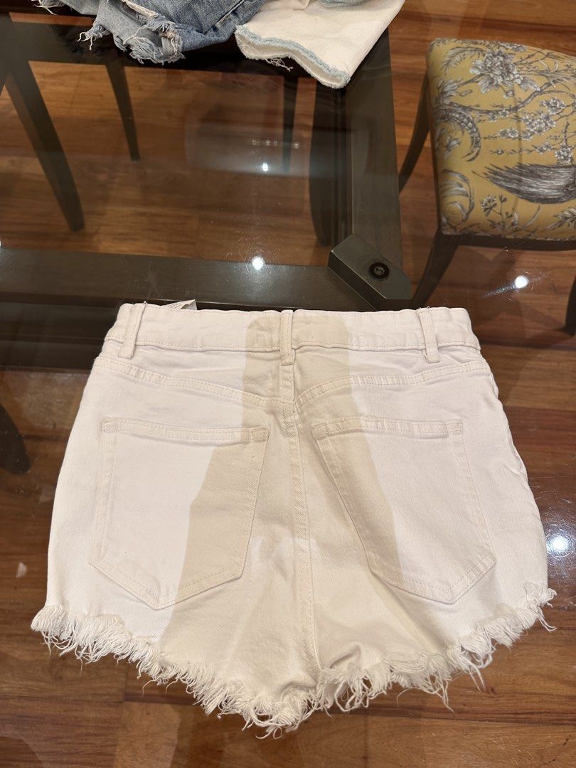 White Denim Shorts with Frayed Hem (Category: Shorts) located in Manila. Submitted by natashaalex (Listing ID 1455599149, Image 2). Description: - White denim shorts - High-waisted fit - Frayed hem detail - Zipper and button front closure - Ideal for casual wear - Versatile: pairs easily with any top.