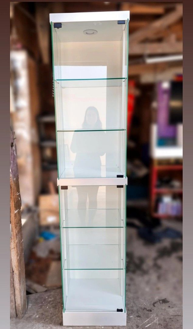 White Glass Display Cabinet with LED Lighting (Category: Shelves, Cabinets & Racks) located in Manila. Submitted by ronav25916562 (Listing ID 1455592810, Image 3). Description: - Tall display cabinet (approx. 180cm) - Multiple glass shelves for display - Built-in LED lighting at the top - Clean, modern aesthetic - Ideal for showcasing collectibles, figures, or decor - Suitable for any room.