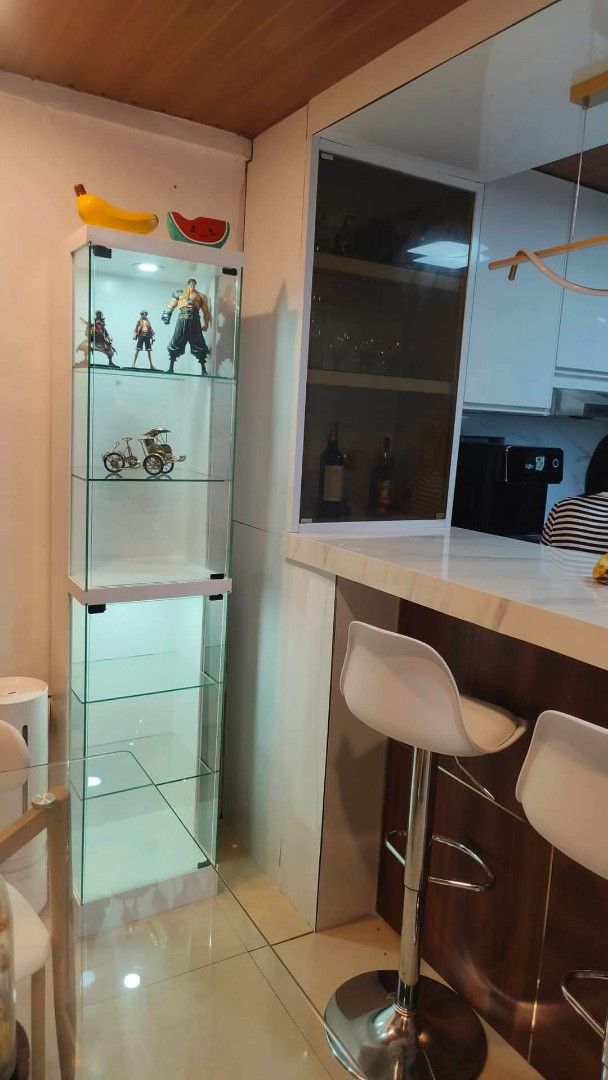 White Glass Display Cabinet with LED Lighting (Category: Shelves, Cabinets & Racks) located in Manila. Submitted by ronav25916562 (Listing ID 1455592810, Image 2). Description: - Tall display cabinet (approx. 180cm) - Multiple glass shelves for display - Built-in LED lighting at the top - Clean, modern aesthetic - Ideal for showcasing collectibles, figures, or decor - Suitable for any room.
