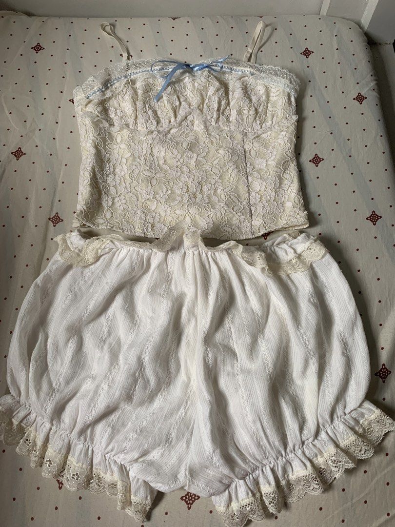White Lace Cami Top with Blue Ribbon (Category: Sleeveless) located in Cainta. Submitted by iris_22 (Listing ID 1455576963, Image 2). Description: - Medium on Tag but can fit on small-med - Cute white lace camisole - Adjustable straps - Adorable blue ribbon bow detail at the front.