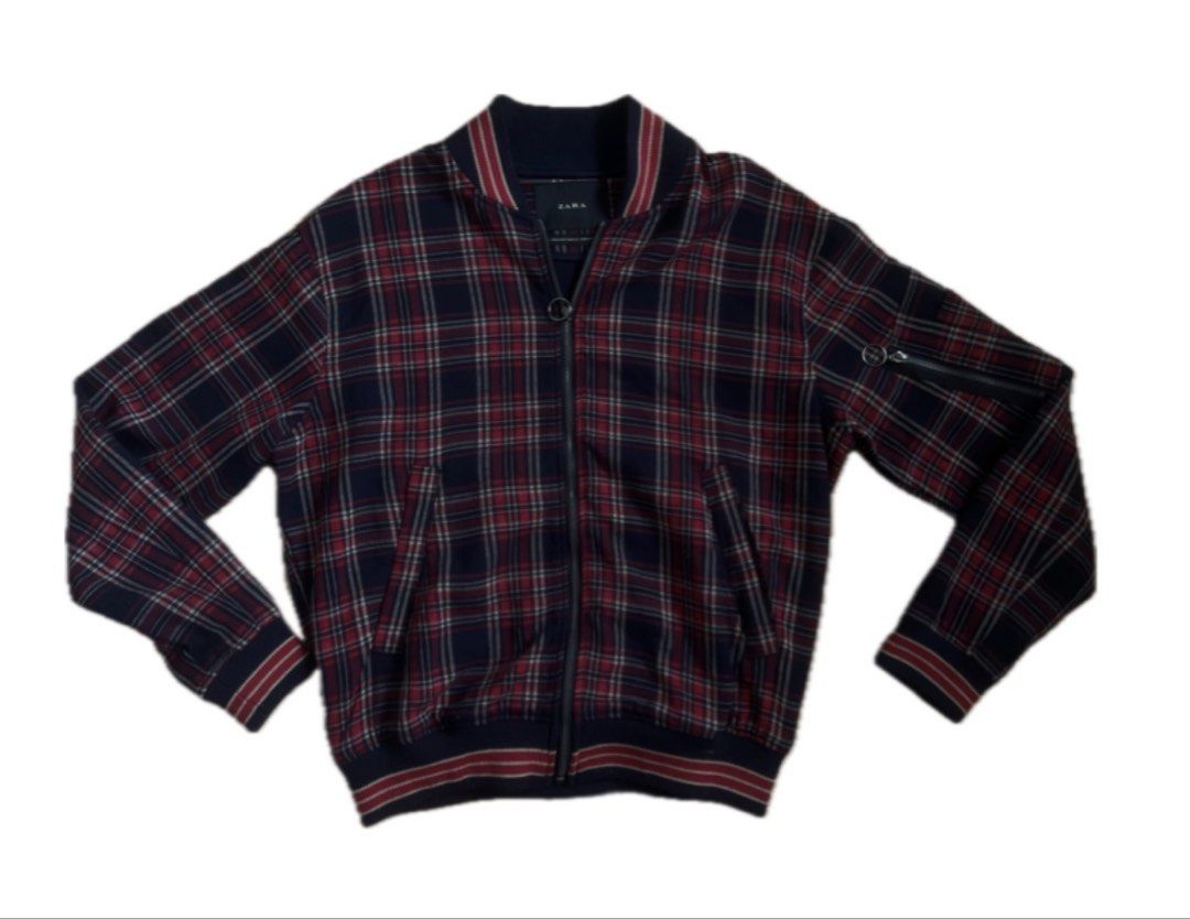 Zara Plaid Bomber Jacket (Category: Coats, Jackets and Outerwear) located in Quezon City. Submitted by rie.berns67 (Listing ID 1455535973, Image 1). Description: Navy and red plaid bomber jacket from Zara. Zip-up front with a ring pull. Ribbed collar, cuffs, and hem. Zipper pocket on the sleeve. - Length: 26 inches - Width: 23 inches Loc: QC.