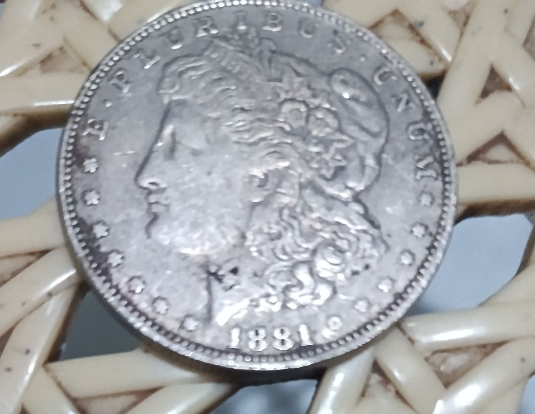 1881 Morgan Silver Dollar Coin S-mint mark (Category: Currency) located in Caloocan City. Submitted by jhaydenzy (Listing ID 1455818600, Image 1). Description: - Authentic 1881 Morgan Silver Dollar coin - Features Lady Liberty on the obverse (front) - Features an eagle on the reverse (back) - Made in the USA - Classic collectible for coin enthusiasts - Excellent addition to any collection.