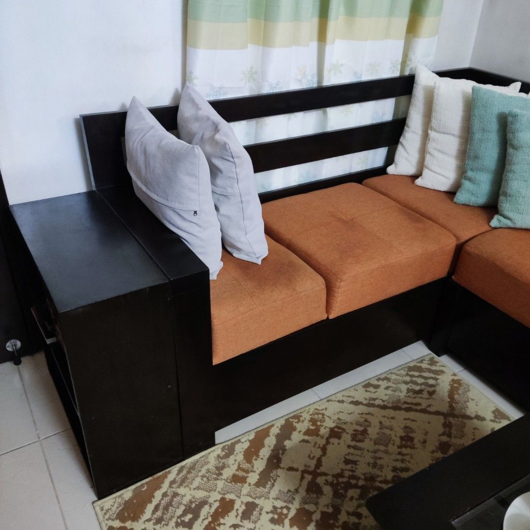 4 seater L shaped sofa with side storage (Category: Sofas) located in Quezon City. Submitted by borj_09760268163 (Listing ID 1455816683, Image 2). Description: As is where is Kiln dry mahogany sofa Original price 29000 center table included throw pillows and other fixtures not included price negotiable RFS need funds for tuition.
