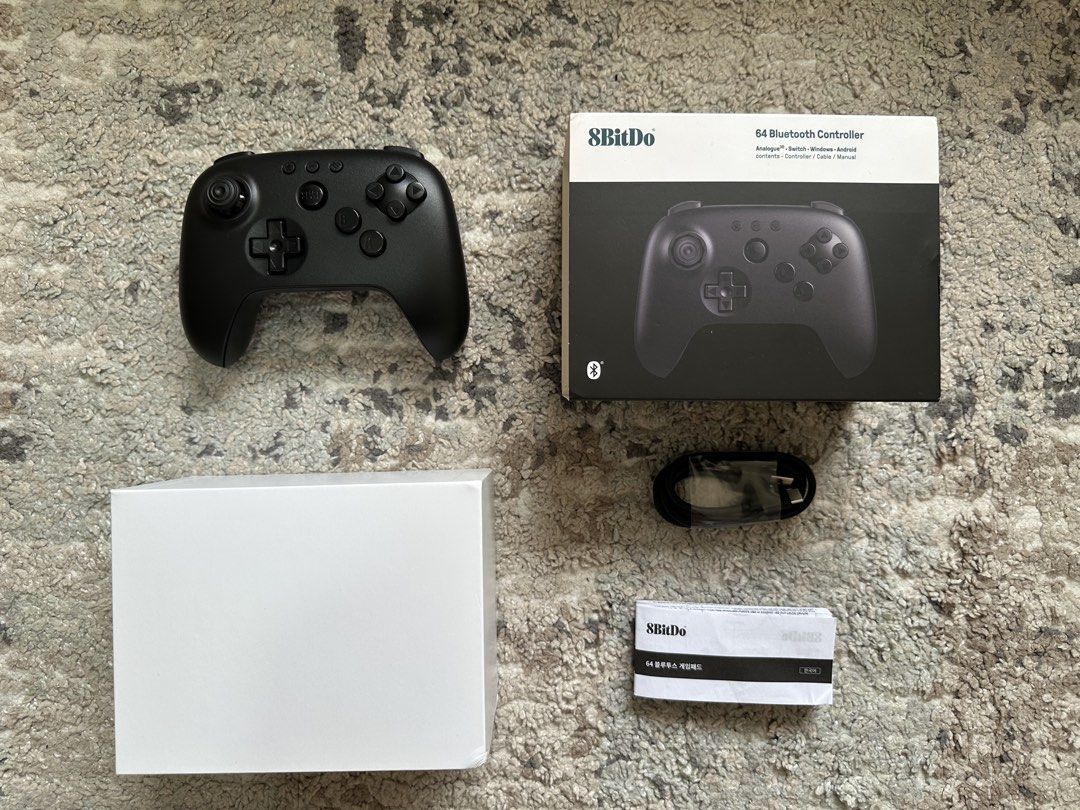 8BitDo 64 Bluetooth Controller (Category: Controllers) located in Manila. Submitted by rostce (Listing ID 1455711471, Image 3). Description: * Like new - used to test on my Nintendo Switch only * Inclusions: Controller, box, USB plug, and paperwork (no receipt) * No issues - just plug and play * Bought from Datablitz * Model: 8BitDo 64 Bluetooth Controller * Design: N64-inspired, modern dual-grip layout * Joysticks: Hall Effect analog joystick * 