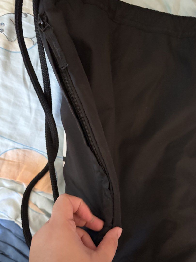 Adidas Drawstring Bag with Zipper Pocket (Category: Backpacks) located in Imus. Submitted by lenochkalia (Listing ID 1455767948, Image 3). Description: - Classic black Adidas drawstring bag - Features iconic trefoil logo - Includes convenient side zipper pocket - Made in Cambodia - Ideal for gym sessions or everyday carry.