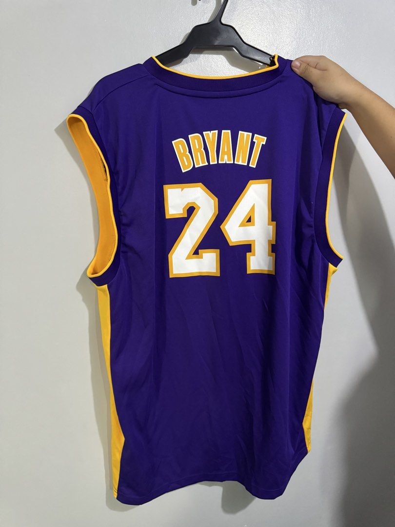 Adidas Kobe Bryant #24 Lakers Jersey (Category: Activewear) located in Manila. Submitted by midnightbobel (Listing ID 1455767582, Image 2). Description: Adidas Los Angeles Lakers jersey featuring Kobe Bryant #24 * Classic purple and gold Lakers colorway * Lakers logo and #24 detailing on the front * Adidas and NBA branding * Sleeveless basketball jersey with V-neck design * Lightweight athletic material * Size: XL.