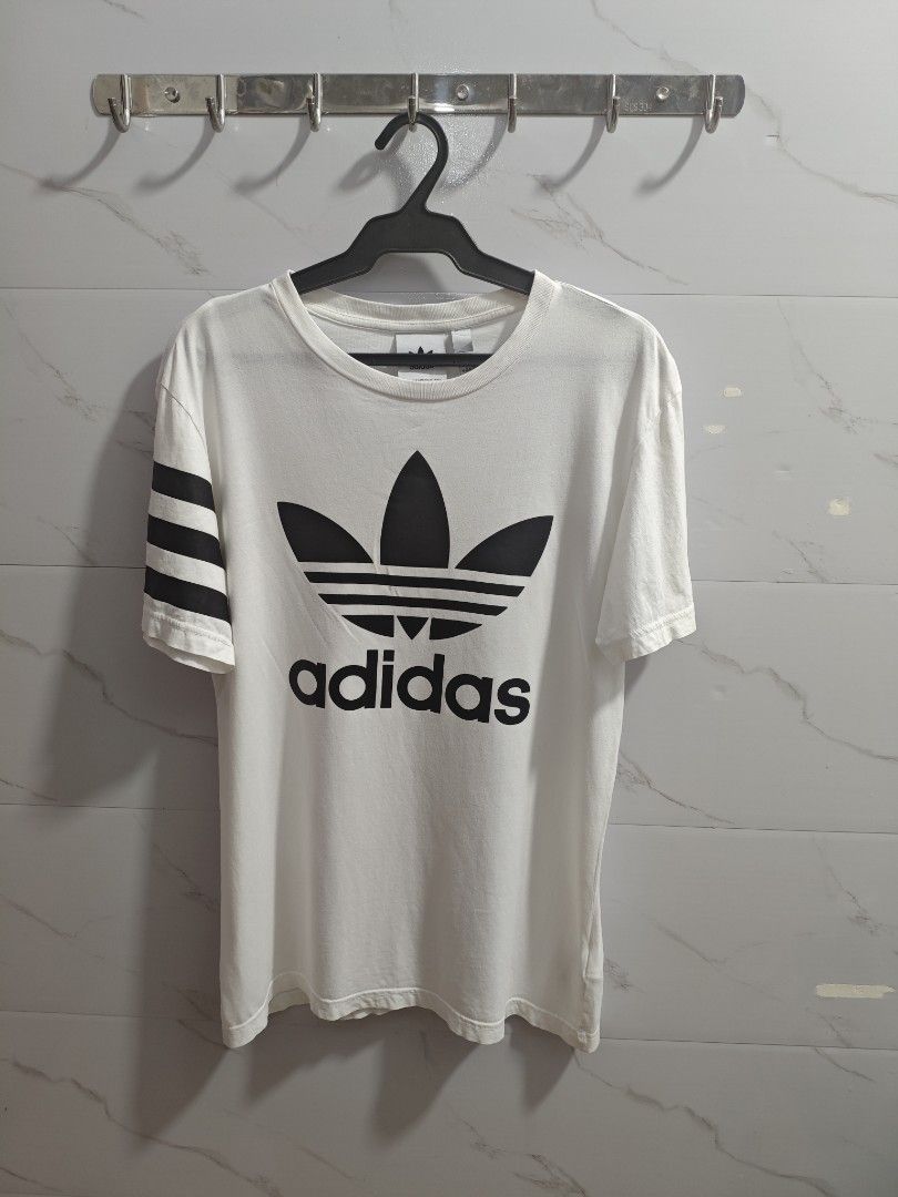 Adidas Three Stripes World Brand Men Tshirt (Category: Tshirts & Polo Shirts ) located in Baguio. Submitted by jayjay_apparel01 (Listing ID 1455774401, Image 1). Description: Adidas Three Stripes World Brand Men Tshirt Color Rate 9.8/10 Flaw Minimal Hole Complete Tags Cotton Tela Machine Washed Size Large Dimes 21 Width 28 Length Price P220.