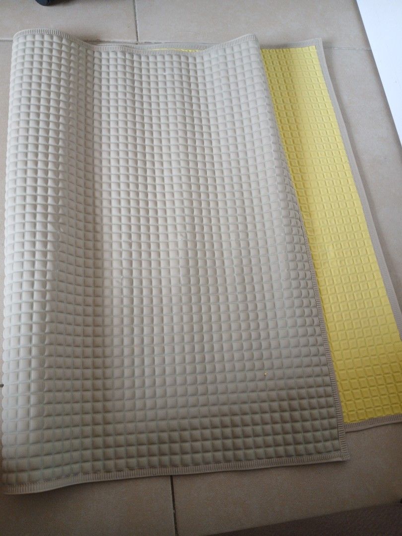 Air Filled Diaper Changing/ Pee Pad (Category: Changing Mats & Accessories) located in Manila. Submitted by relaxlang (Listing ID 1455726432, Image 2). Description: Air-filled rubber changing mat (or rubber baby pee pad/sheet). 36.5 x 23.5 Key Features: Material: Made of soft, natural rubber with tiny air-filled bubbles. Design: Features a distinct square waffle/grid texture that provides cushioning and prevents sticking. Function: It is complete