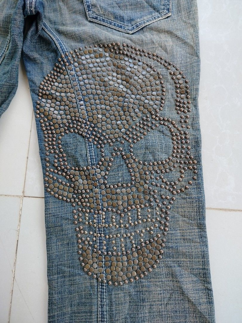 Antik Denim Studded Skull Jeans (Category: Jeans) located in Clarin. Submitted by thriftfinds.2026 (Listing ID 1455794698, Image 3). Description: - Cool Antik Denim jeans - Large studded skull design on right leg - Studded detailing on front pockets - Distressed look with rips - Unique back pocket embroidery - Belt included - Flare leg style.