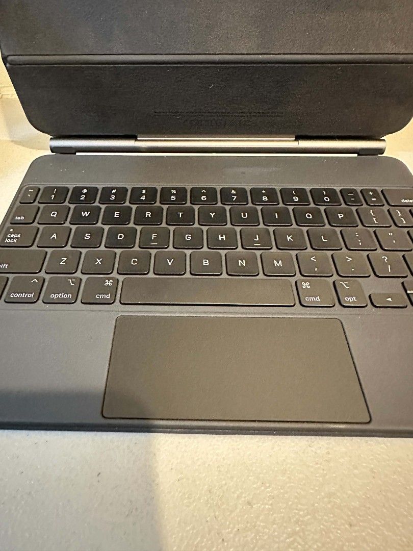 Apple Magic Keyboard for iPad Pro 11-inch (3rd Gen) (Category: Cases & Sleeves) located in Makati City. Submitted by OnlyMTG (Listing ID 1455809495, Image 2). Description: - Apple Magic Keyboard for 11-inch iPad Pro - Built-in trackpad for seamless navigation - Backlit keys for comfortable typing in any light - Attaches magnetically for a secure fit - Shows minor signs of use on the exterior fabric.