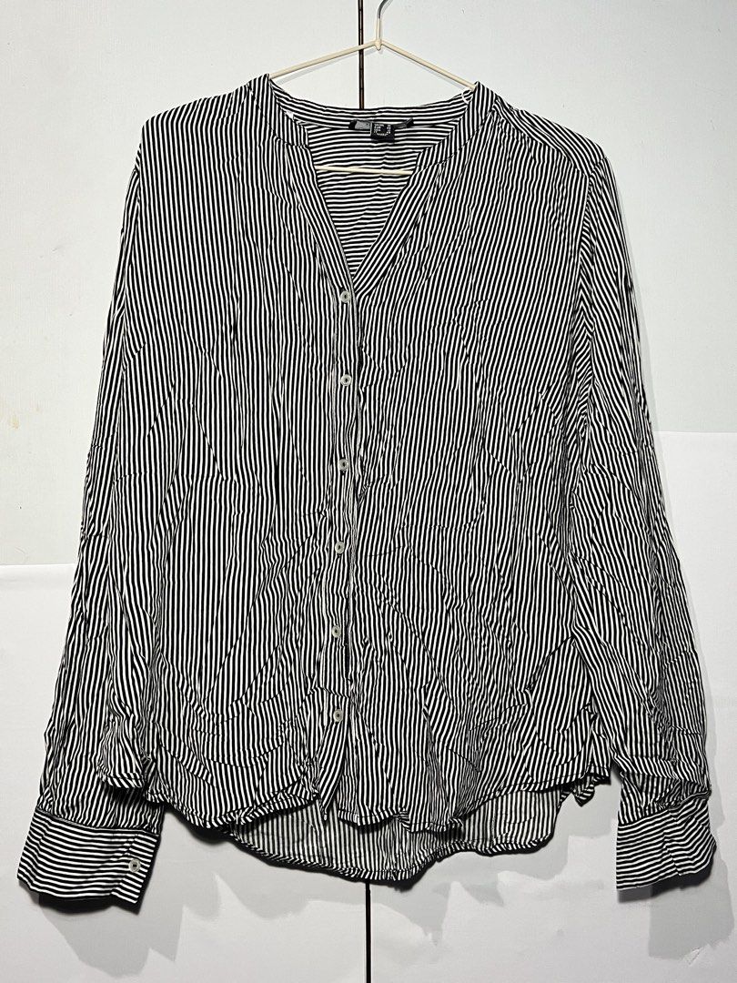 Atmosphere Black & White Striped Long Sleeve Blouse (Category: Longsleeves) located in Quezon City. Submitted by ishaan1423 (Listing ID 1455706417, Image 1). Description: Atmosphere black and white vertical striped long sleeve blouse in UK size 16 (US 12). Features a flattering V-neck band collar, button-front closure, and roll-tab sleeves for versatile styling. Lightweight and comfortable, perfect for office wear, casual outfits, or smart casual