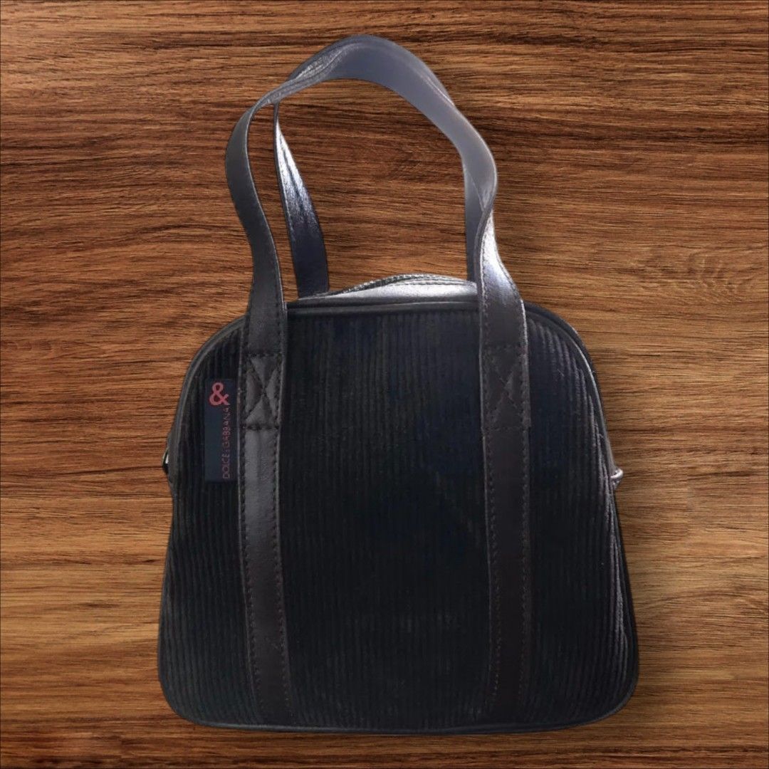 Auth Dolce & Gabbana Curduroy n' Leather Bag (Category: Luxury Bags & Wallets) located in Cebu City. Submitted by jc_online_shop (Listing ID 1455723350, Image 1). Description: 10" x 12" x 3" dark choco color curduroy and genuine leather material zip closure with hologram sticker Made in Italy.