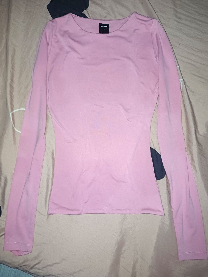 Baby Pink Long Sleeve Top (Category: Longsleeves) located in Valenzuela. Submitted by cybct (Listing ID 1455712063, Image 2). Description: - Soft and very stretchy fabric - Designed for a close-to-body fit - Versatile for layering or wearing solo - Features a simple crew neck - Pairs well with jeans or skirts.