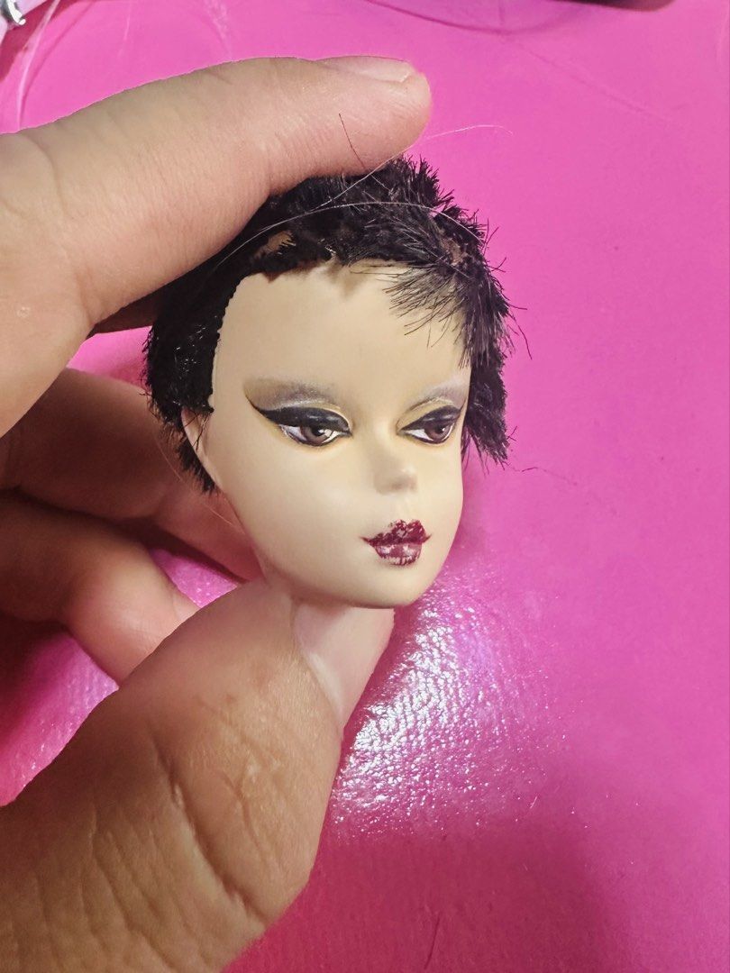 Barbie Doll Head SILKSTONE - For Customization (Category: Makeup) located in Santa Maria. Submitted by houseofluckytoystore (Listing ID 1455795149, Image 1). Description: - Striking Barbie doll head - Features detailed makeup: dramatic eyeliner & deep red lips - Dark brown, short-styled hair - Perfect for doll customization projects - Ideal as a replacement part - Unique, eye-catching look - Please check photos for exact condition.