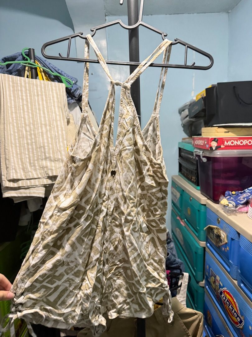 Billabong Romper Size S-M (Category: Rompers) located in Manila. Submitted by clairedeee (Listing ID 1455682736, Image 2). Description: - Billabong romper - Size: S-M - Color: Tan and white abstract print - Style: Racerback - Features: Ruched sides with drawstring detail - Fabric: Lightweight and breezy - Occasion: Perfect for summer days out.