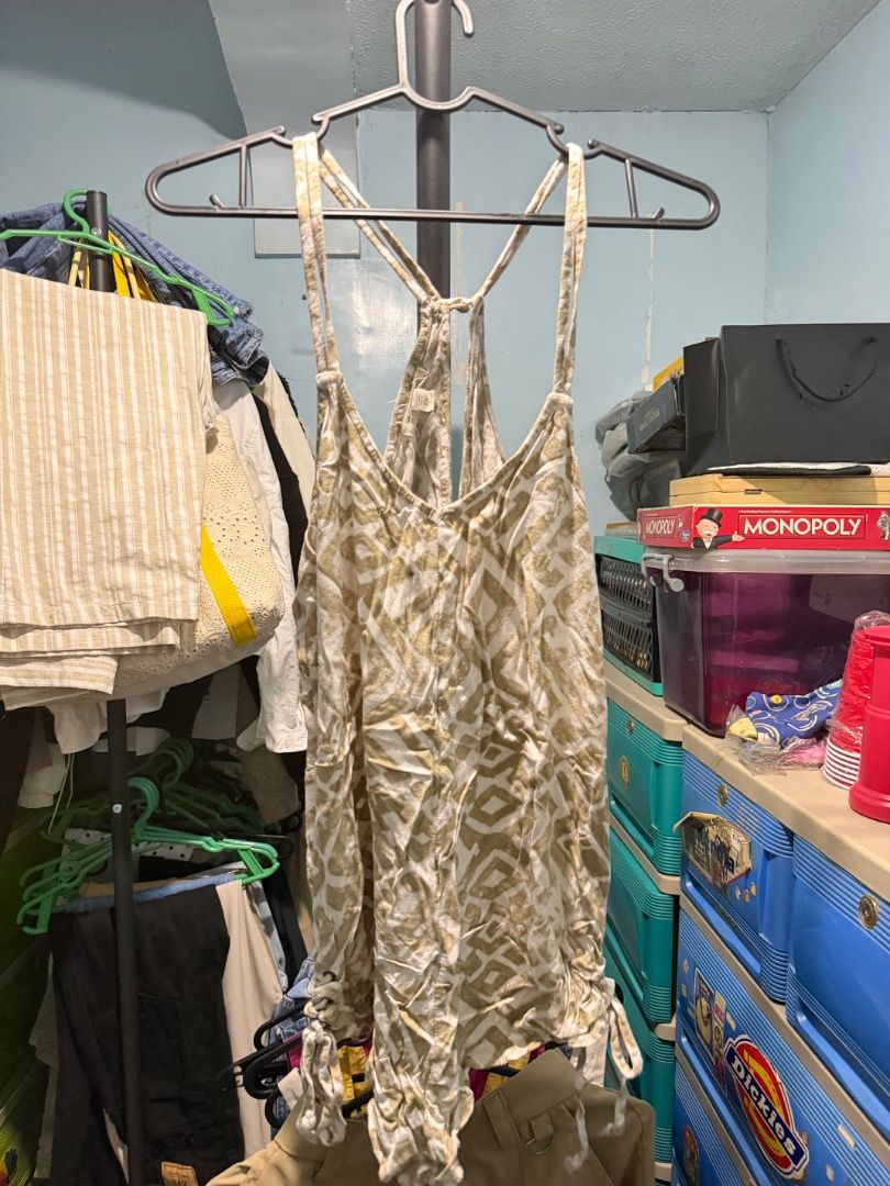Billabong Romper Size S-M (Category: Rompers) located in Manila. Submitted by clairedeee (Listing ID 1455682736, Image 3). Description: - Billabong romper - Size: S-M - Color: Tan and white abstract print - Style: Racerback - Features: Ruched sides with drawstring detail - Fabric: Lightweight and breezy - Occasion: Perfect for summer days out.