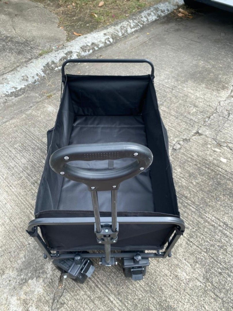 Black Folding Wagon Cart with Wheels (Category: Hiking & Camping) located in Manila. Submitted by shairatorres (Listing ID 1455703583, Image 3). Description: - Sturdy black folding wagon - Ideal for groceries, beach gear, or pets - Easy to pull with handle - Folds down for compact storage - Durable fabric and strong frame - Perfect for outdoor adventures and everyday errands.