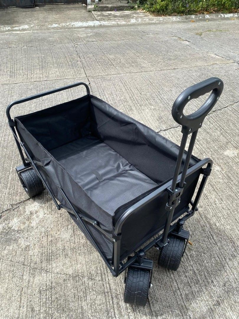 Black Folding Wagon Cart with Wheels (Category: Hiking & Camping) located in Manila. Submitted by shairatorres (Listing ID 1455703583, Image 1). Description: - Sturdy black folding wagon - Ideal for groceries, beach gear, or pets - Easy to pull with handle - Folds down for compact storage - Durable fabric and strong frame - Perfect for outdoor adventures and everyday errands.