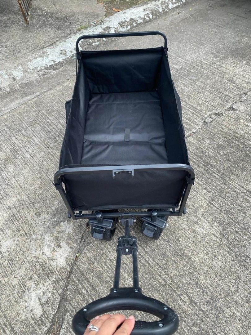 Black Folding Wagon Cart with Wheels (Category: Hiking & Camping) located in Manila. Submitted by shairatorres (Listing ID 1455703583, Image 2). Description: - Sturdy black folding wagon - Ideal for groceries, beach gear, or pets - Easy to pull with handle - Folds down for compact storage - Durable fabric and strong frame - Perfect for outdoor adventures and everyday errands.