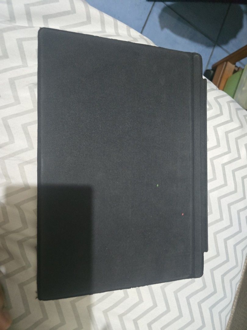 Black Keyboard Cover for Microsoft Surface Pro (Category: Computer Keyboard) located in Pasig City. Submitted by aangelic (Listing ID 1455761109, Image 3). Description: - Black keyboard cover - Compatible with Microsoft Surface Pro (likely) - Minor cosmetic imperfections: small red and green specks on surface - Visible wear on edges - Sold as is.