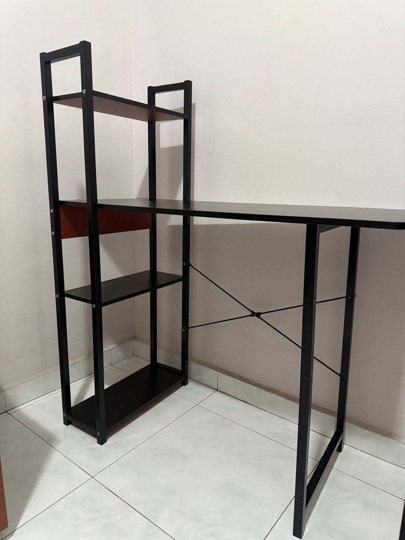 study / computer table (Category: Tables & Sets) located in Singapore. Submitted by tingchu00 (Listing ID 1455698652, Image 1). Description: - Study desk with integrated shelving - Sturdy black metal frame - Dark wood shelves - Ample workspace and storage - Ideal for home office or student room - Simple assembly required - Dimensions: Approx. 120cm (W) x 60cm (D) x 140cm (H).