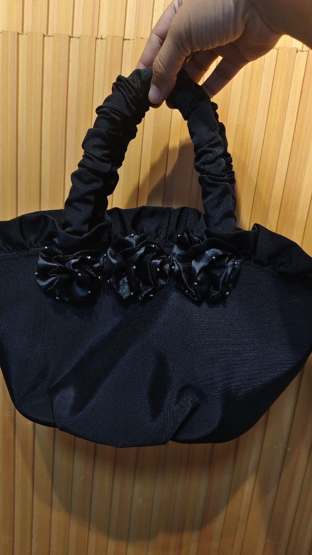 Black Ruched Handle Handbag with Floral Embellishments (Category: Shoulder Bags) located in Bulacan. Submitted by babz30261 (Listing ID 1455729809, Image 3). Description: - Cute black handbag - Ruched handles - Fabric flowers with bead details on the front - Satin lining inside - Interior pockets - Zipper closure - Ideal for night outs or special occasions.