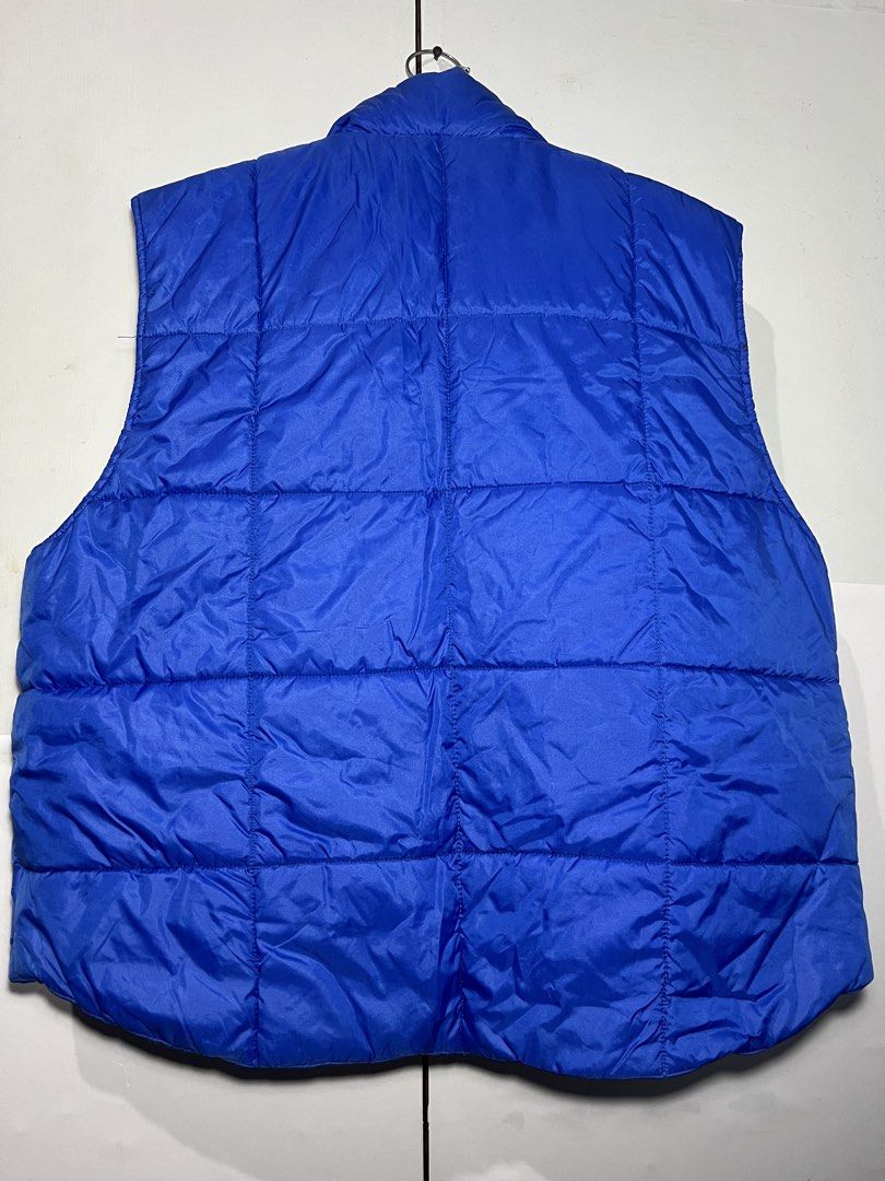 Blue Puffer Vest (Category: Vests) located in Quezon City. Submitted by ishaan1423 (Listing ID 1455706401, Image 2). Description: - Classic blue puffer vest - All-over quilted design - Button-up front - Functional pockets - Ideal for layering - Great for casual wear.