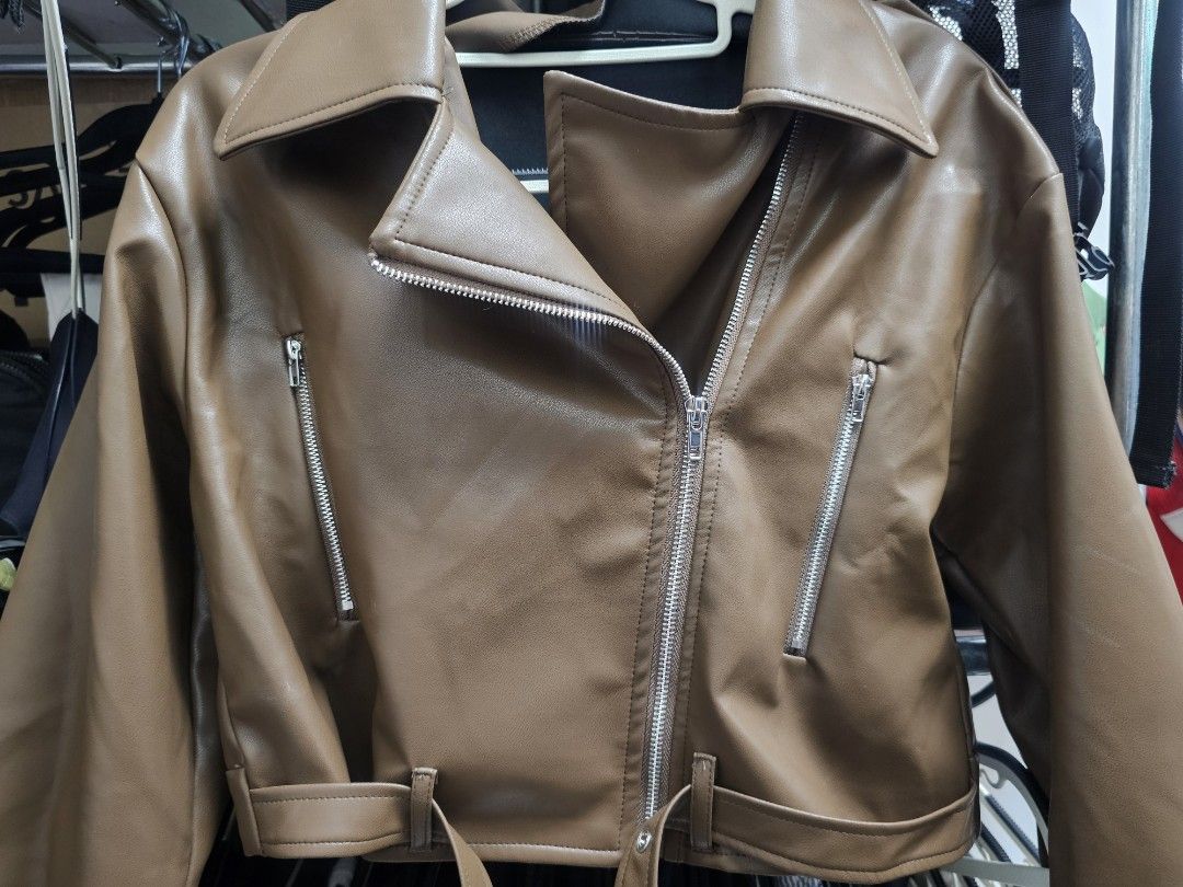 Brown PU Leather Biker Jacket with Silver Zippers (Category: Coats, Jackets and Outerwear) located in Paranaque City. Submitted by rhodalietagle (Listing ID 1455844780, Image 3). Description: - Cool brown PU leather jacket - Classic biker style - Asymmetrical zip front - Zippered chest and side pockets - Belt detail at the hem - Versatile for layering over jeans or dresses - Use once, sa baguio last july lang. Pinangrampa - Orig price : 1,382.00 