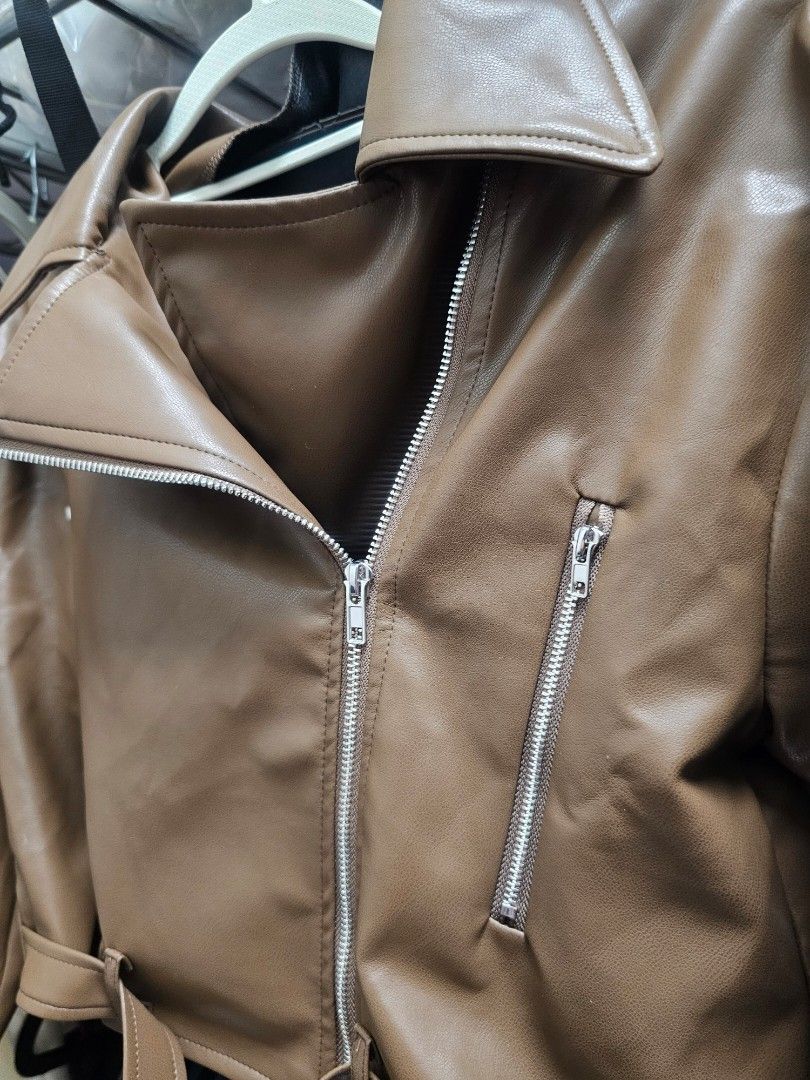 Brown PU Leather Biker Jacket with Silver Zippers (Category: Coats, Jackets and Outerwear) located in Paranaque City. Submitted by rhodalietagle (Listing ID 1455844780, Image 2). Description: - Cool brown PU leather jacket - Classic biker style - Asymmetrical zip front - Zippered chest and side pockets - Belt detail at the hem - Versatile for layering over jeans or dresses - Use once, sa baguio last july lang. Pinangrampa - Orig price : 1,382.00 