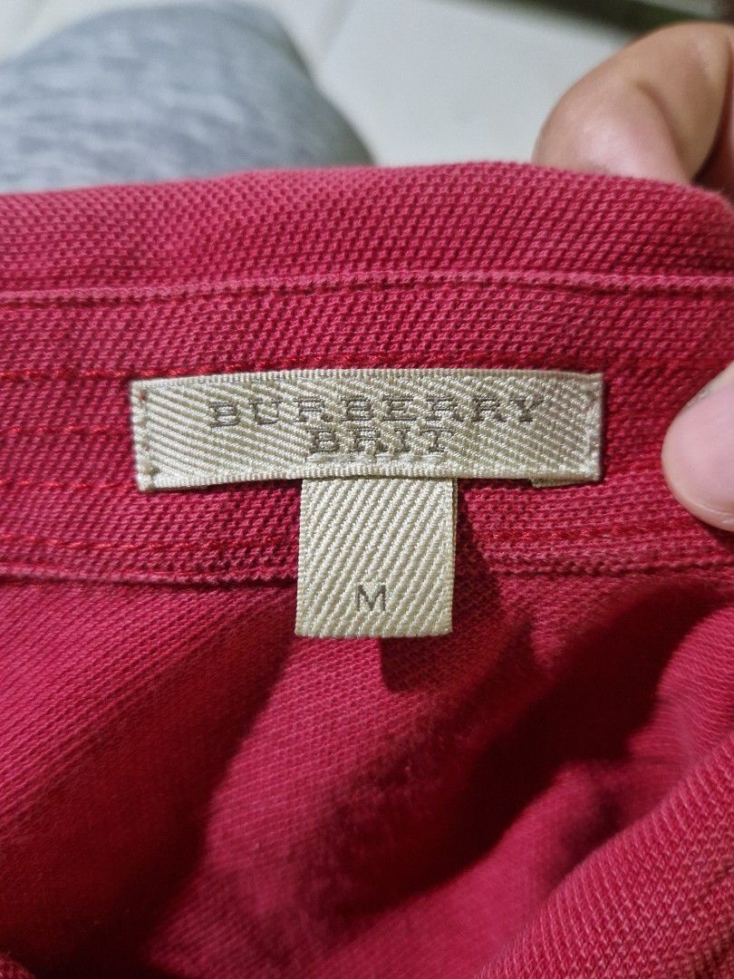 Burberry Red Polo Shirt Size M (Category: Tshirts & Polo Shirts ) located in Cebu City. Submitted by marckythrift (Listing ID 1455683990, Image 3). Description: -Ganyan talaga kulay nya dark red - Color rate 9.8 or better - Classic red Burberry polo shirt - Features iconic embroidered Burberry knight logo - Made in Turkey - 100% cotton - Tagged size M - Ideal for casual wear.