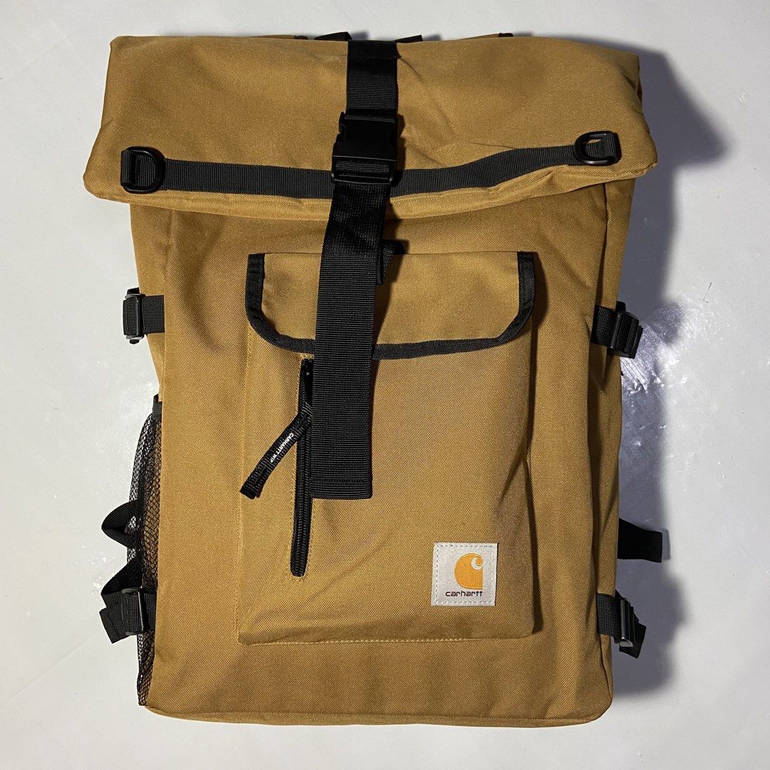 Carhartt WIP Backpack Tan Roll Top (Category: Backpacks) located in Manila. Submitted by ashiee111 (Listing ID 1455837795, Image 1). Description: - Tan Carhartt WIP backpack - Roll top design with buckle closure - Front zip pocket - Side mesh pockets - Padded straps for comfort - Internal laptop sleeve - Ideal for daily use or travel.