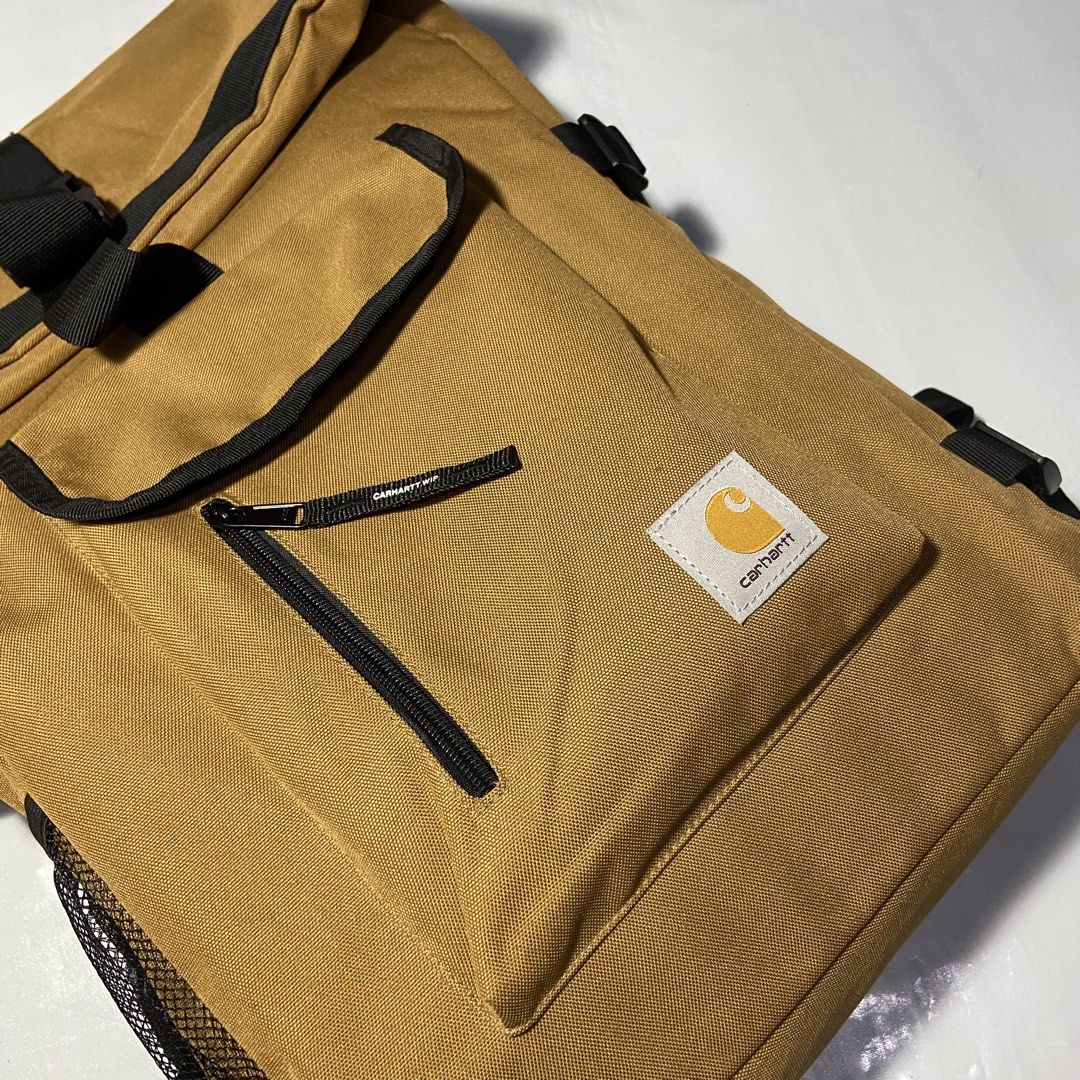 Carhartt WIP Backpack Tan Roll Top (Category: Backpacks) located in Manila. Submitted by ashiee111 (Listing ID 1455837795, Image 2). Description: - Tan Carhartt WIP backpack - Roll top design with buckle closure - Front zip pocket - Side mesh pockets - Padded straps for comfort - Internal laptop sleeve - Ideal for daily use or travel.