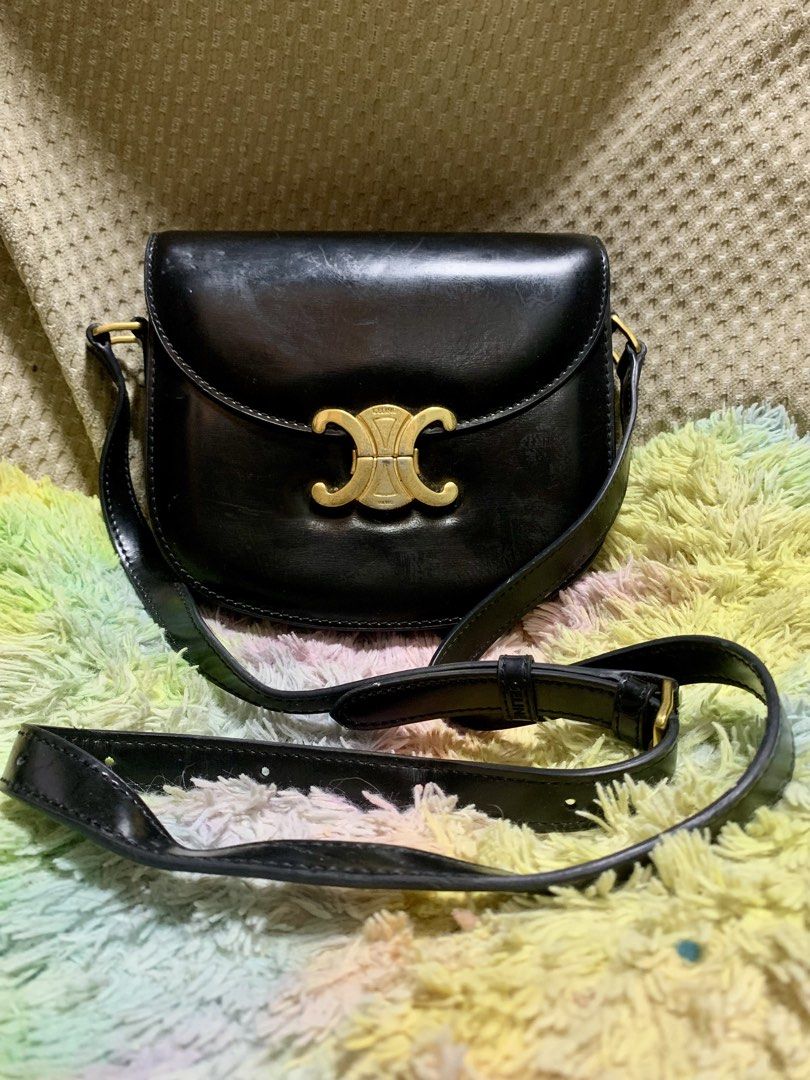 Celine Triomphe Mini Shoulder Bag Black Leather (Category: Luxury Bags & Wallets) located in General Santos City (Dadiangas). Submitted by h_thrift_luxxe (Listing ID 1455738055, Image 1). Description: - Japan Surplus - Classic black Celine shoulder bag - Iconic gold Triomphe clasp - Adjustable leather strap - Some signs of wear on leather and hardware (consistent with use) - No major issues - Bag has a nice sheen - Versatile for everyday or speci