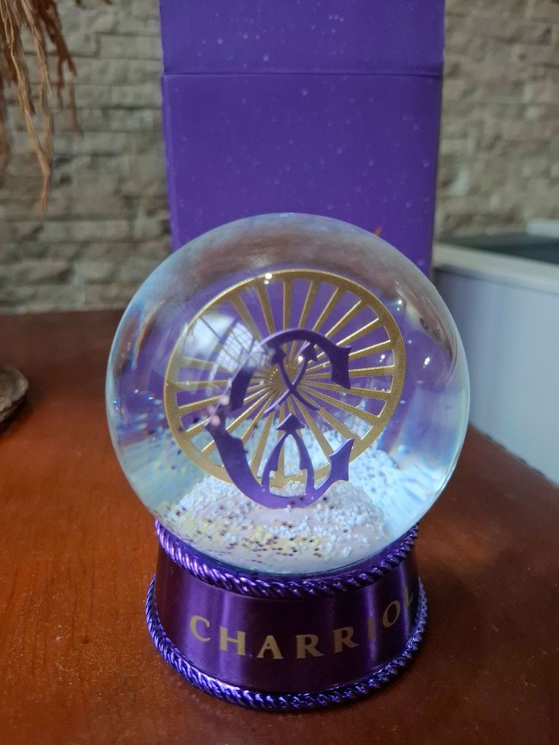 CHARRIOL Geneva Le Different Snow Globe with Box (Category: Other Home Decor) located in Makati City. Submitted by itemsforless2025 (Listing ID 1455687952, Image 2). Description: - Authentic CHARRIOL Geneva Snow Globe - Features 'Le Different' slogan on the box - CHARRIOL logo with glitter inside the globe - Includes original purple CHARRIOL box - A great collectible item for enthusiasts.