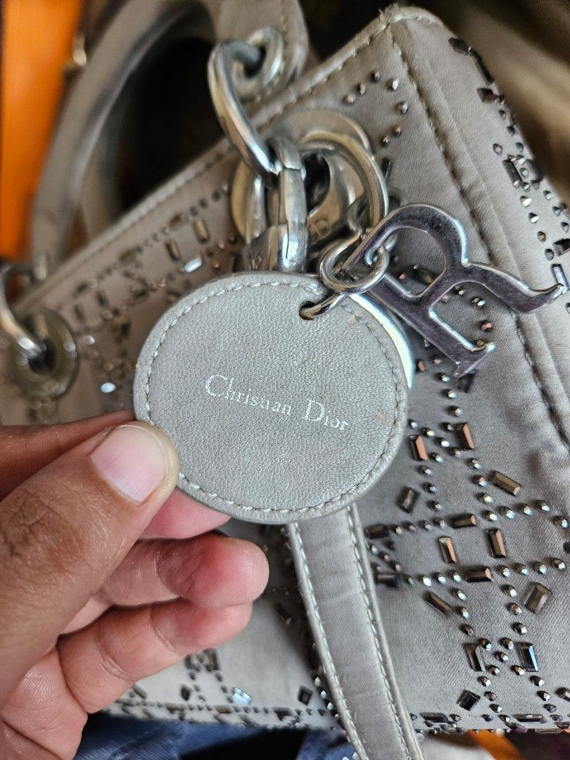 Christian Dior Cannage Studded Handbag (Category: Luxury Bags & Wallets) located in Manila. Submitted by clayd052 (Listing ID 1455692064, Image 3). Description: - Christian Dior handbag - Iconic cannage pattern with stud embellishments - Top handles and detachable shoulder strap - Interior zippered pocket - Minor signs of wear on handles and hardware - A classic, timeless piece NGA.