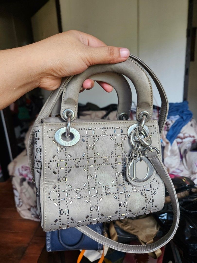 Christian Dior Cannage Studded Handbag (Category: Luxury Bags & Wallets) located in Manila. Submitted by clayd052 (Listing ID 1455692064, Image 1). Description: - Christian Dior handbag - Iconic cannage pattern with stud embellishments - Top handles and detachable shoulder strap - Interior zippered pocket - Minor signs of wear on handles and hardware - A classic, timeless piece NGA.