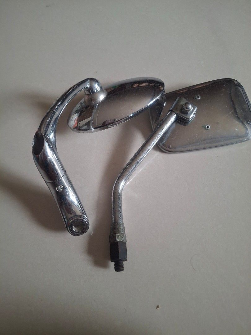 Chrome Motorcycle Mirrors Pair (Category: Mirrors) located in Lipa City. Submitted by theretromanph (Listing ID 1455690241, Image 3). Description: - Classic chrome motorcycle mirrors - Fits handlebars - One rectangular mirror, one oval mirror - Minor signs of wear on chrome.