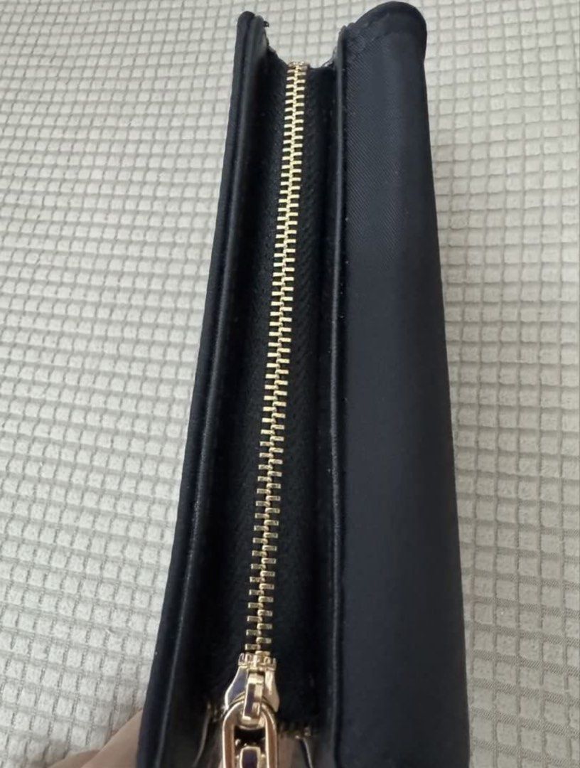 CLN Black Tri-fold Wallet with Gold Logo (Category: Wallets & Card holders) located in Quezon City. Submitted by tinamartinez (Listing ID 1455754382, Image 3). Description: - Black CLN tri-fold wallet - Multiple card slots - Coin pocket - Gold CLN logo on front - Comes with original dust bag, box, and tag - Ideal for organizing essentials.