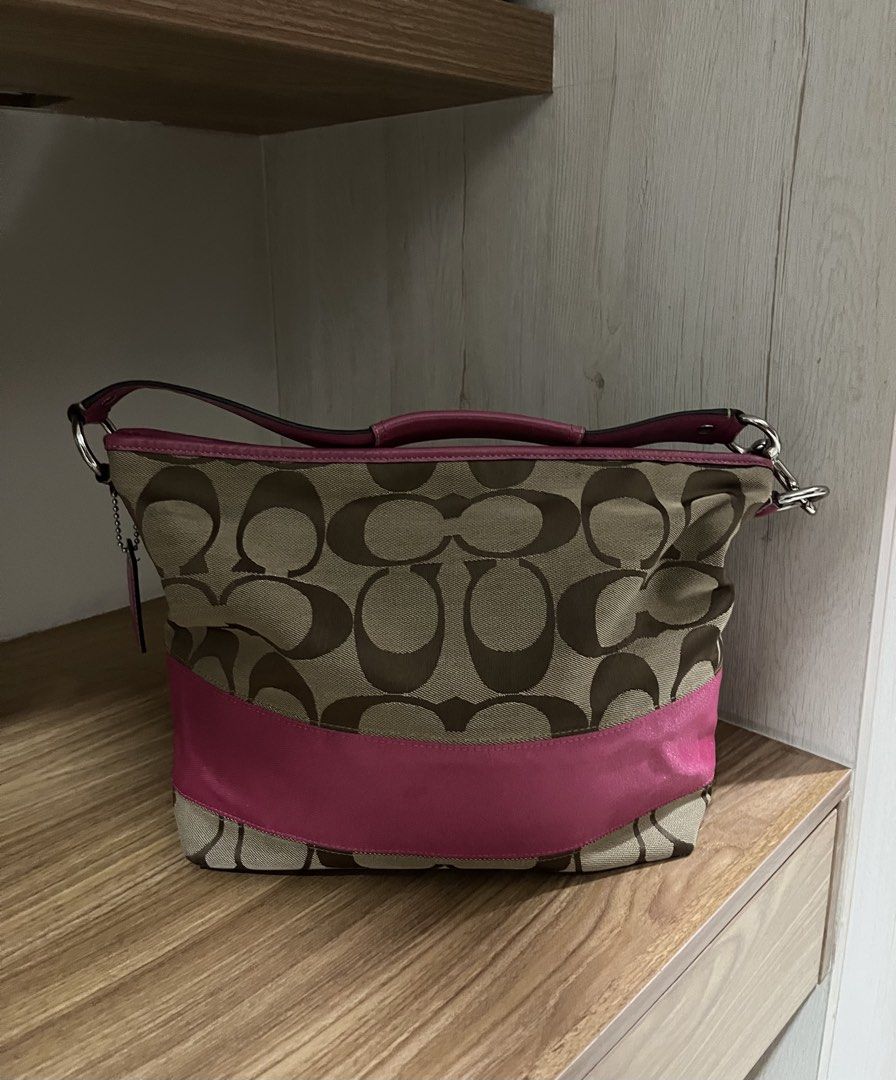 Coach Pink Stripe Hobo bag (Category: Luxury Bags & Wallets) located in Meycauayan. Submitted by preloved_clothes_by_kath (Listing ID 1455781280, Image 1). Description: - Authentic Coach monogram canvas shoulder bag - No issues -Decluttering - Condition 9/10.