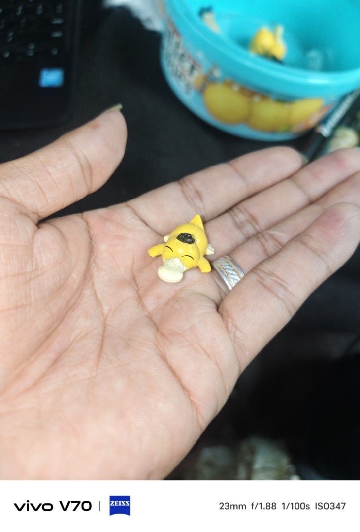 Cute Psyduck Pokemon Figure Keychain Charm (Category: Character Goods) located in Kapangan. Submitted by ClumZyDale (Listing ID 1455718211, Image 3). Description: prices range from 120-700 - Adorable yellow Psyduck figure - Perfect for Pokemon fans and collectors - Can be used as a keychain or bag charm - Small and portable for easy carrying - Great for decorating bags, backpacks, or keys - A fun and unique collectible item.