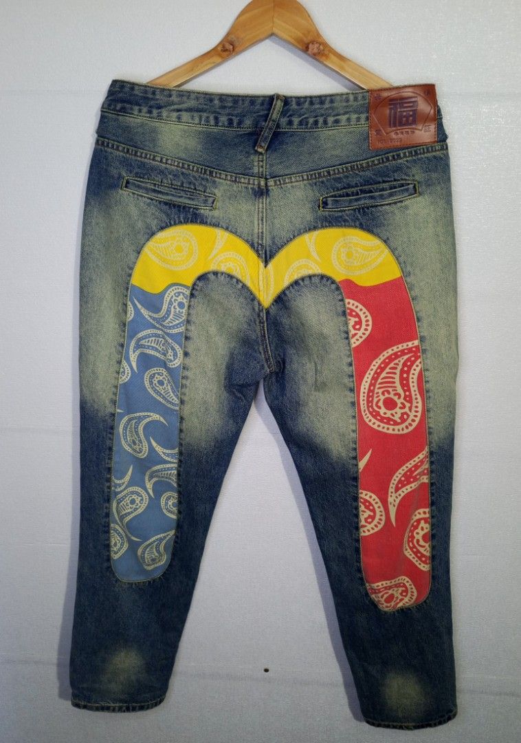 Denim Jeans with Paisley Patch Design (Category: Jeans) located in Manila. Submitted by lenardanth13124 (Listing ID 1455652584, Image 1). Description: - Blue denim jeans - Size 34 - Unique faded wash effect - Eye-catching paisley patch on the back - Patch colors: Yellow, Blue, Red - Perfect statement piece for your outfit LENGTH: 40 WAIST: 35 HEM: 7.