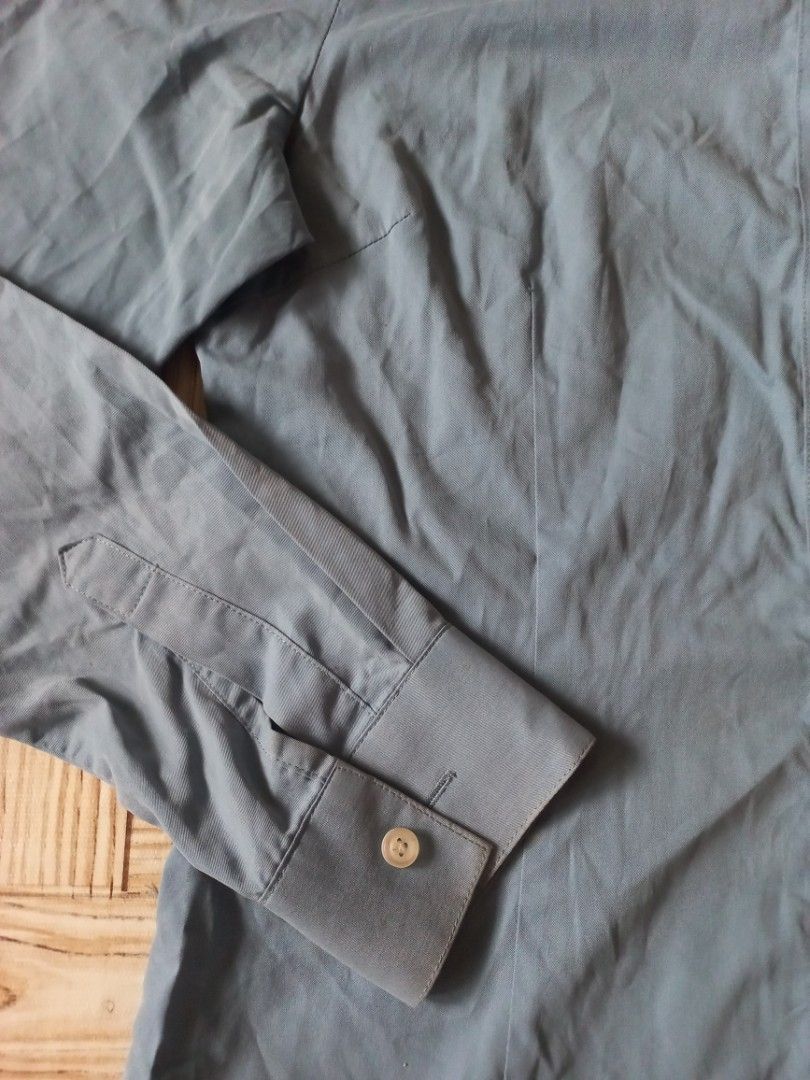 Dian Xian Blue Button-Up Shirt Size S (Category: Longsleeves) located in Rizal. Submitted by magi_declutters (Listing ID 1455727590, Image 2). Description: - Dian Xian Blue Button-Up Shirt - Size: S - Measurements: Length 60 cm, Width 40 cm, Arm hole 18 cm - Features: Long sleeves with button cuffs - Style: Simple, classic, versatile for work or casual wear.