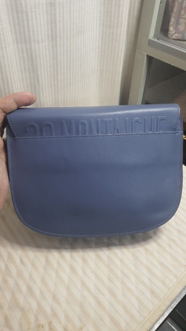 Dior Saddle Bag Blue Leather (Category: Luxury Bags & Wallets) located in Manila. Submitted by togodbethegloryteamjesus (Listing ID 1455681841, Image 3). Description: - Blue Leather Dior Bobby Saddle Bag - NGA please Self Authenticate - Iconic CD Clasp and Buckle Closure - Embossed '30 MONTAIGNE' Detail on Back - Elegant Gold Hardware - Secure Magnetic Snap Closure Inside - Sling strap has slight faded hardware - Versatile for Everyday or Special