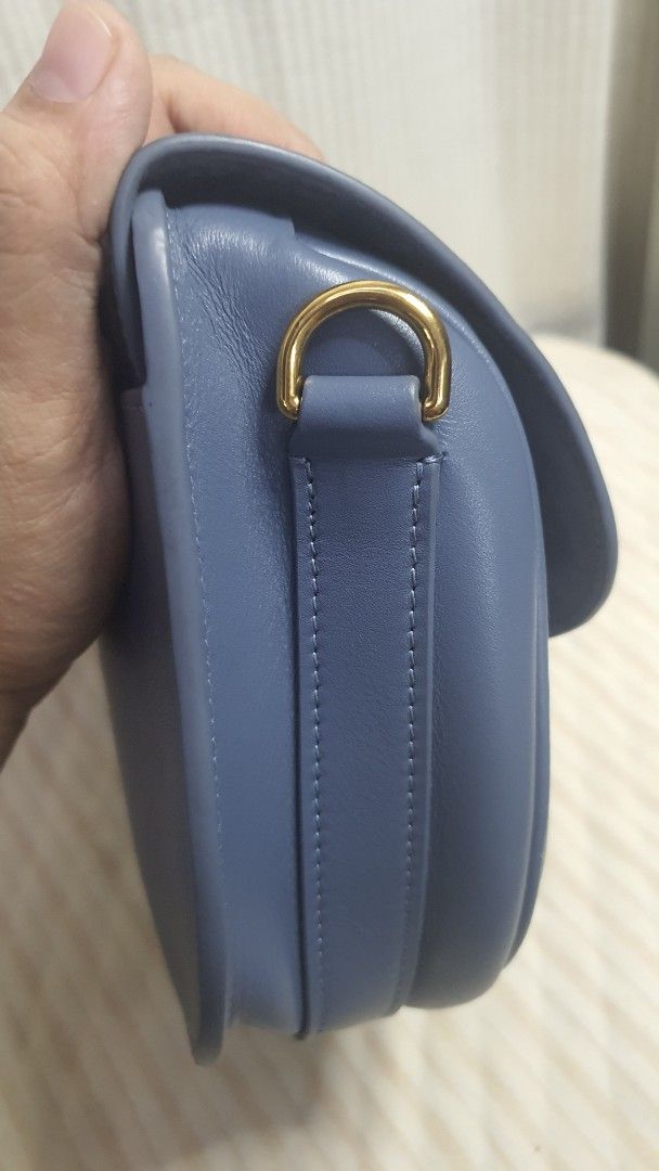 Dior Saddle Bag Blue Leather (Category: Luxury Bags & Wallets) located in Manila. Submitted by togodbethegloryteamjesus (Listing ID 1455681841, Image 2). Description: - Blue Leather Dior Bobby Saddle Bag - NGA please Self Authenticate - Iconic CD Clasp and Buckle Closure - Embossed '30 MONTAIGNE' Detail on Back - Elegant Gold Hardware - Secure Magnetic Snap Closure Inside - Sling strap has slight faded hardware - Versatile for Everyday or Special