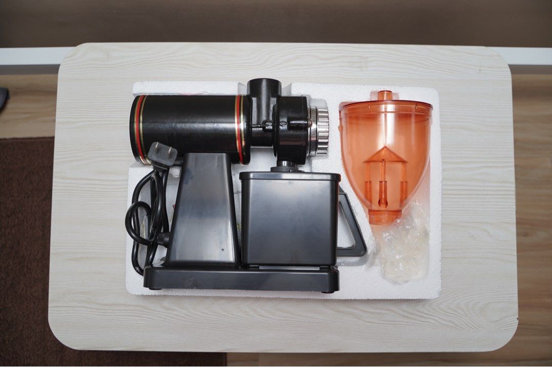 Electric Coffee Mill Grinder (Category: Coffee Machines & Makers) located in Paranaque City. Submitted by daenydaeny (Listing ID 1455736104, Image 3). Description: - Electric coffee grinder - Stylish black and orange design - Perfect for grinding coffee beans - Lightly used, in original packaging - Easy to use for fresh coffee at home.
