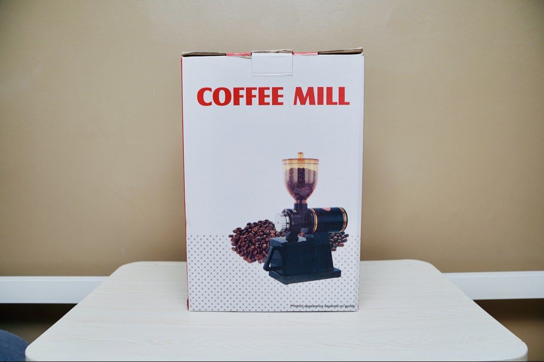 Electric Coffee Mill Grinder (Category: Coffee Machines & Makers) located in Paranaque City. Submitted by daenydaeny (Listing ID 1455736104, Image 1). Description: - Electric coffee grinder - Stylish black and orange design - Perfect for grinding coffee beans - Lightly used, in original packaging - Easy to use for fresh coffee at home.