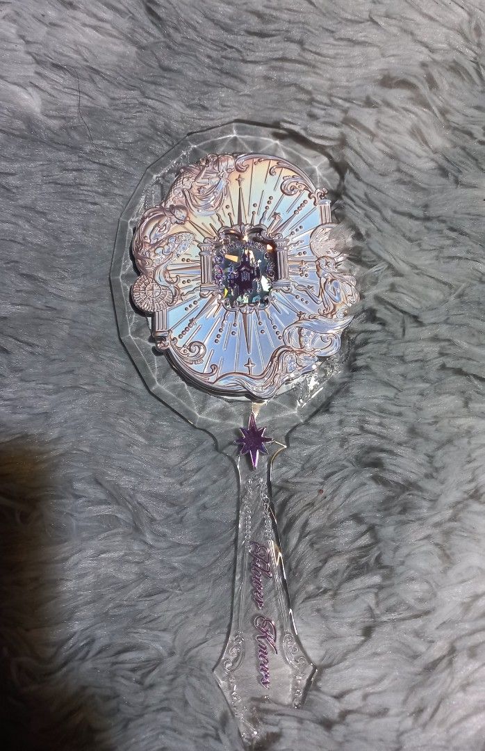 Flower Knows Mirror (Category: Makeup) located in Paranaque City. Submitted by pompomsss (Listing ID 1449037801, Image 1). Description: - Elegant cosmetic mirror with a decorative, ornate design. - Features a stunning holographic/iridescent sheen on the mirror surface. - Includes a convenient handle for easy use. - Comes brand new in its original, sealed packaging. - Ideal for flawless makeup application or as a beautiful decorative accent. Messa
